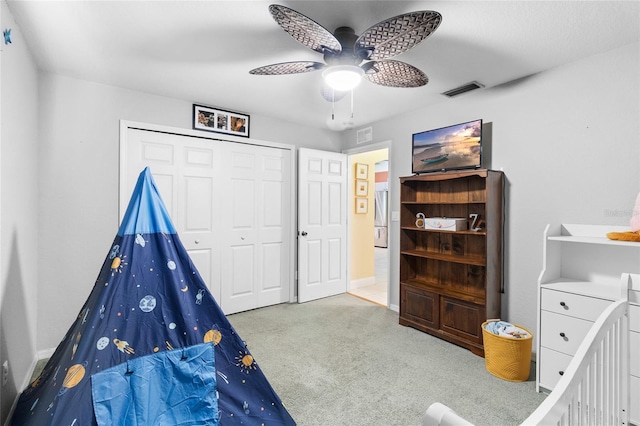 rec room with ceiling fan, carpet flooring, and visible vents