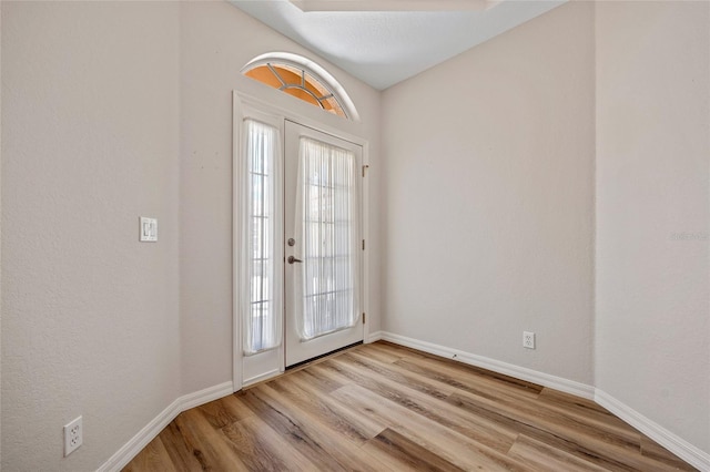 entryway featuring french doors and wood-type flooring