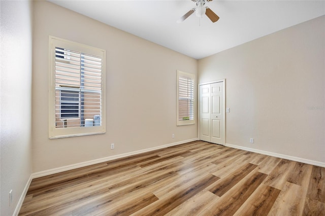 unfurnished room with light hardwood / wood-style floors and ceiling fan