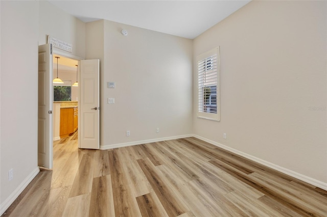 unfurnished room featuring light hardwood / wood-style floors