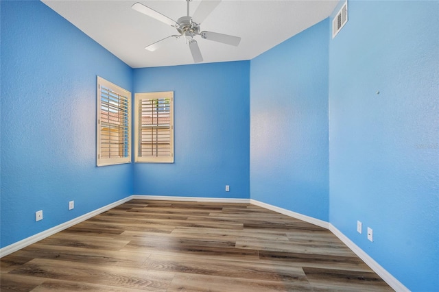 spare room featuring ceiling fan and hardwood / wood-style floors