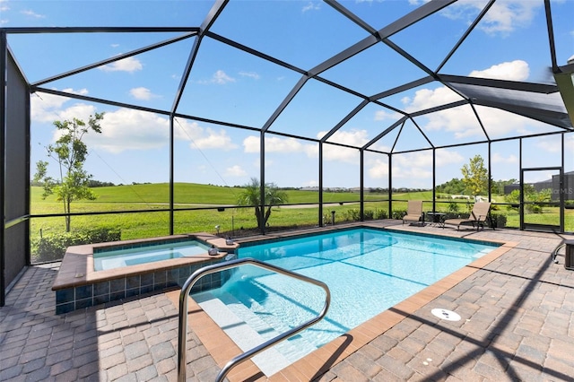 view of swimming pool with an in ground hot tub, glass enclosure, and a patio area