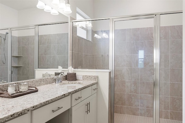 bathroom with vanity and walk in shower