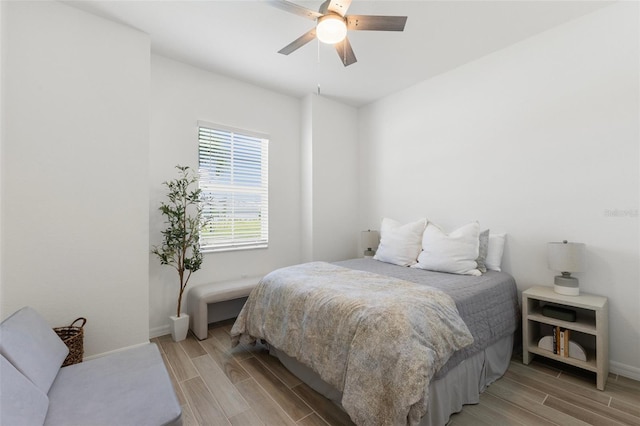 bedroom featuring ceiling fan and light hardwood / wood-style flooring