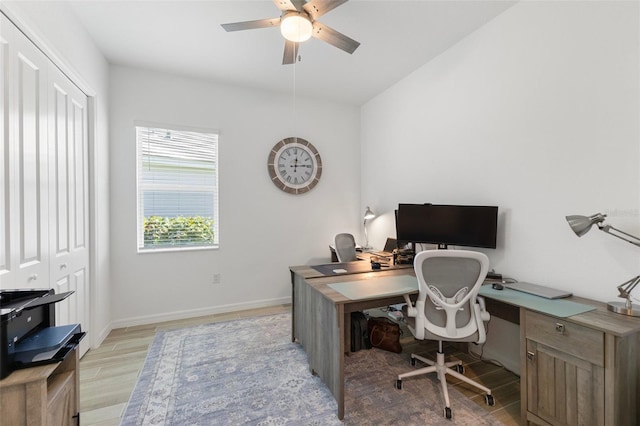 office area with ceiling fan and light hardwood / wood-style flooring