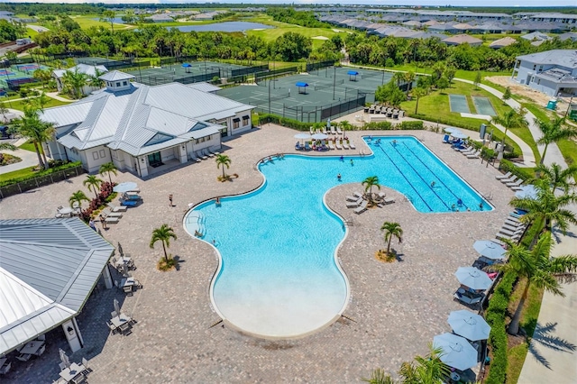 view of swimming pool featuring a patio area