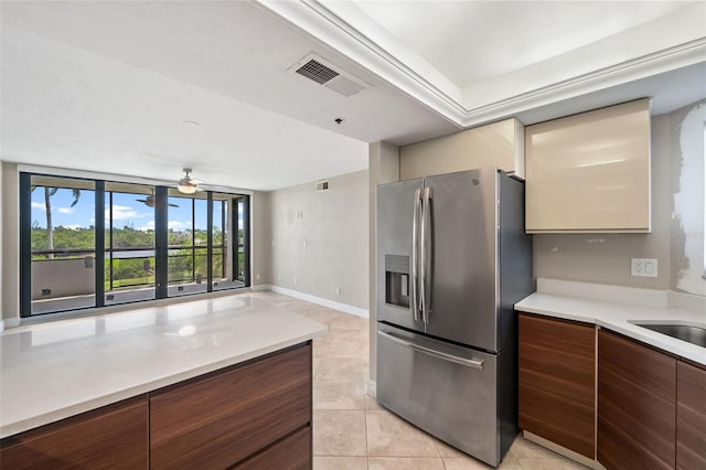 kitchen with light tile patterned flooring, ceiling fan, and refrigerator