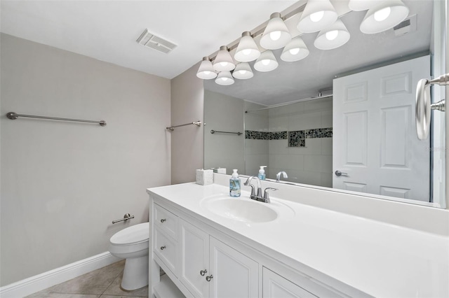 bathroom with tile patterned floors, toilet, and vanity