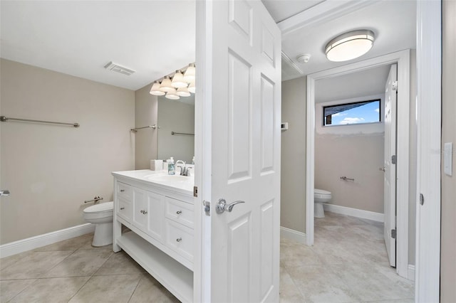 bathroom featuring vanity, tile patterned flooring, a bidet, and toilet