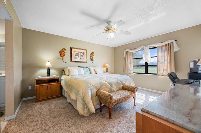 bedroom featuring light carpet and ceiling fan