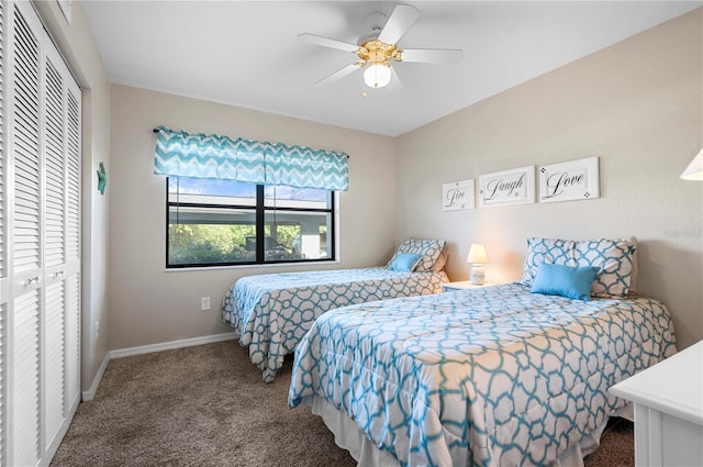 carpeted bedroom with a closet and ceiling fan