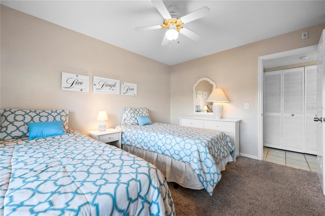 carpeted bedroom with a closet and ceiling fan