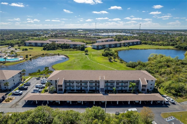 birds eye view of property with a water view