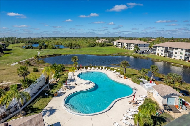 view of pool with a water view and a patio area