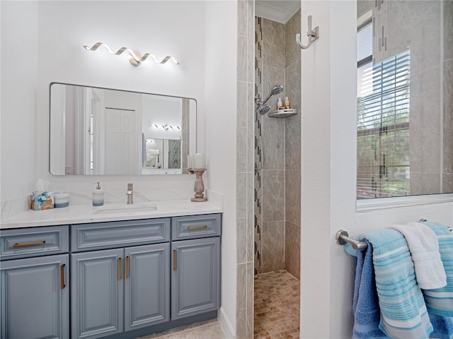 bathroom with walk in shower and vanity