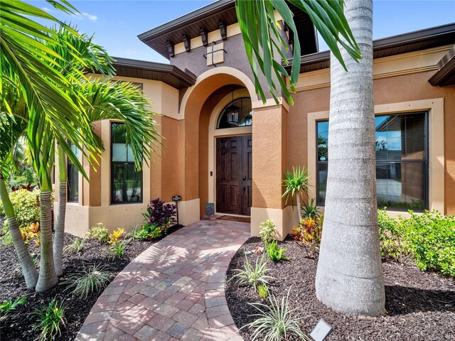 doorway to property with stucco siding