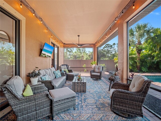 view of patio / terrace with a ceiling fan, a fenced backyard, and an outdoor hangout area