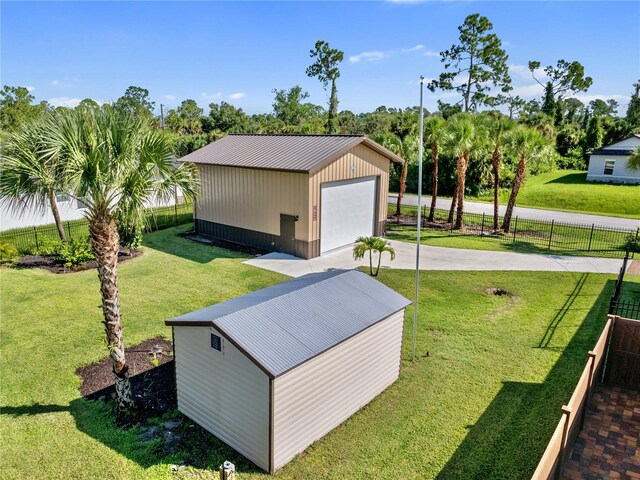 view of outbuilding featuring an outdoor structure and fence