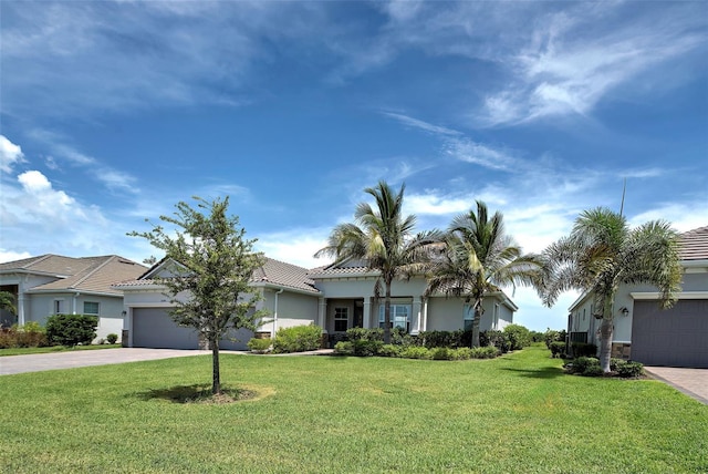 view of front facade with a garage and a front lawn