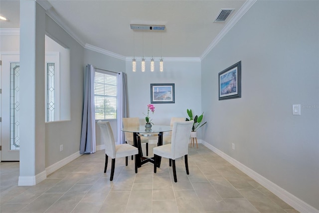 tiled dining area featuring crown molding