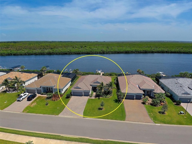 birds eye view of property with a water view