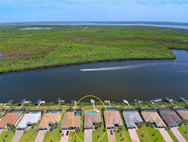 drone / aerial view with a water view