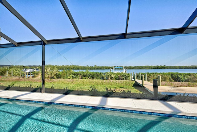 view of pool with a water view and a lanai