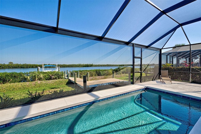 view of pool with a lanai, a patio, and a water view