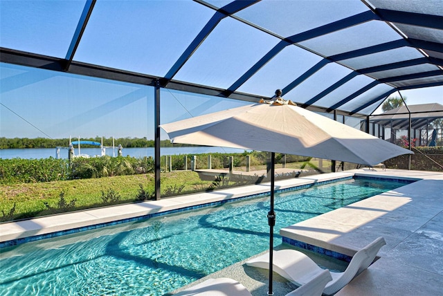 view of pool with a lanai and a water view