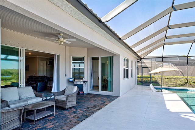 view of patio with an outdoor living space, grilling area, ceiling fan, and glass enclosure