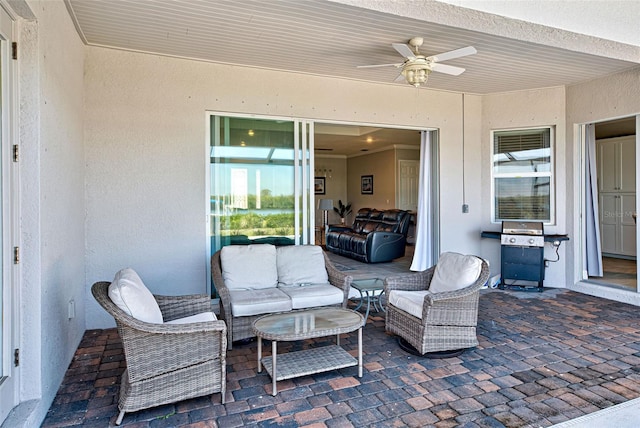 view of patio featuring an outdoor hangout area and ceiling fan