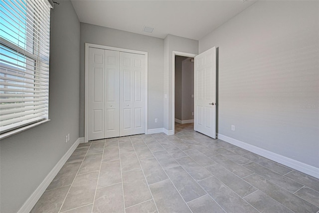 unfurnished bedroom featuring a closet