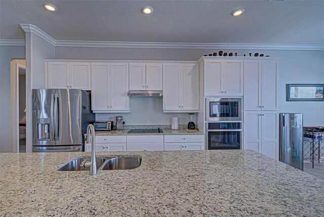 kitchen featuring sink, white cabinetry, crown molding, light stone countertops, and black appliances