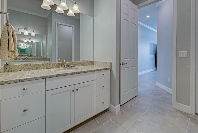 bathroom featuring crown molding, vanity, and tile patterned floors