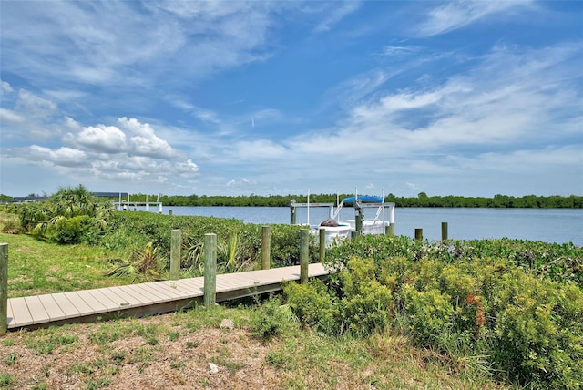 15240 Spanish Point Dr, Port Charlotte, FL 33981 - view of dock featuring a water view and boat lift