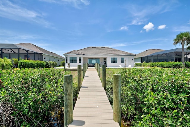 15240 Spanish Point Dr, Port Charlotte, FL 33981 - back of house with stucco siding and a tiled roof