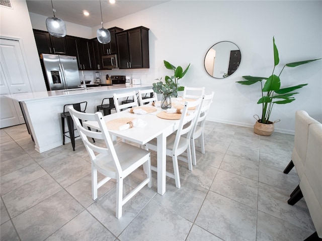 tiled dining area with sink