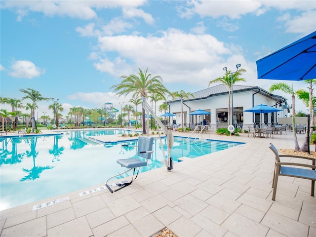 view of swimming pool featuring a patio