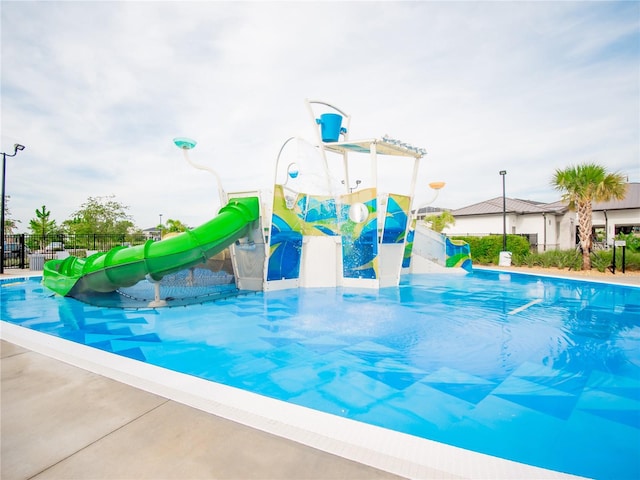 view of pool featuring a water slide