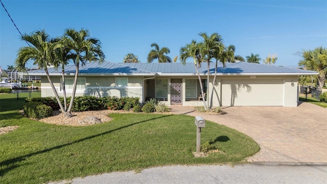 ranch-style house with a front lawn and a garage