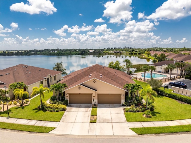 drone / aerial view with a water view