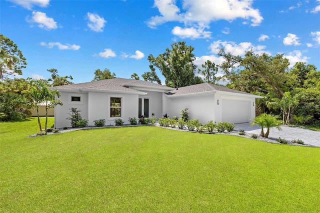 view of front facade with a garage and a front lawn