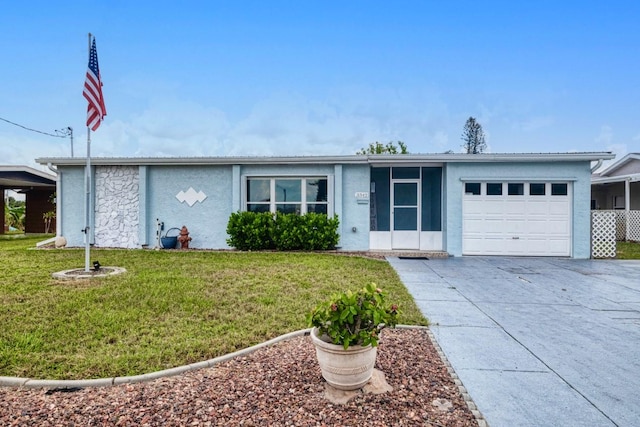 single story home featuring a garage and a front yard