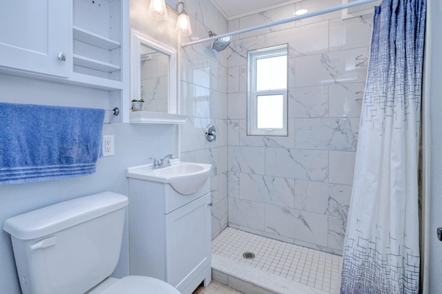 bathroom with curtained shower, vanity, and toilet