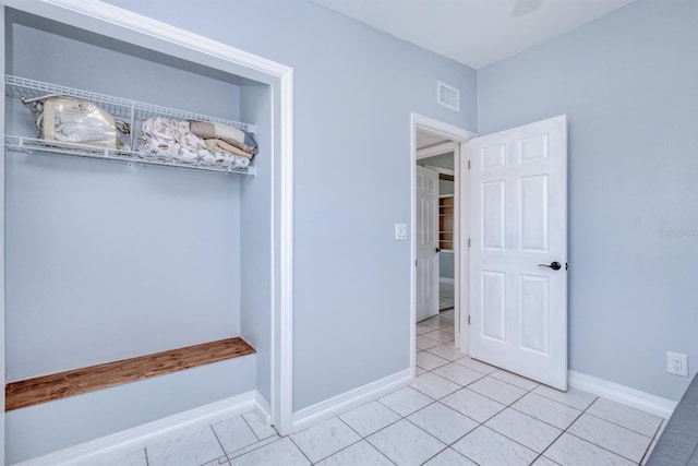 unfurnished bedroom featuring light tile patterned floors