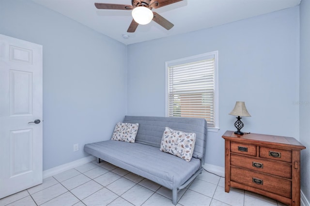 sitting room with ceiling fan and light tile patterned floors