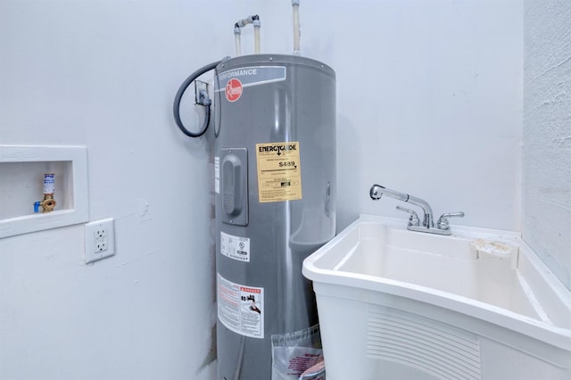 utility room with sink and electric water heater