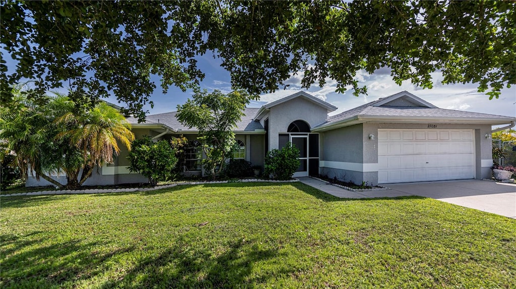 single story home featuring a garage and a front yard