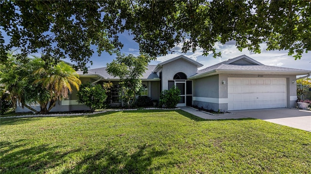 single story home featuring a garage and a front yard