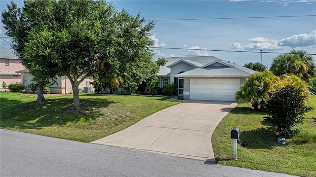 view of front of home with a garage and a front yard